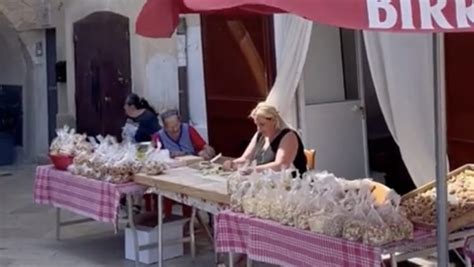 nonna porca|Italian town's 'nonnas' make pasta outside their homes every day.